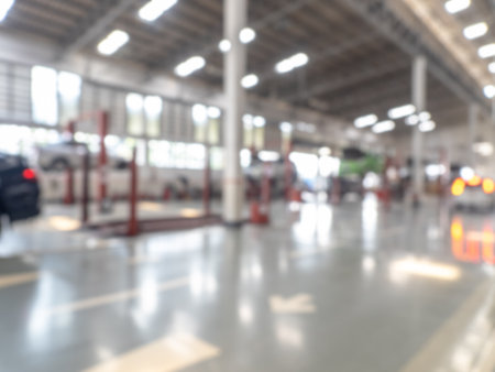 Abstract blur car garage automobile interior. Blurred mechanic service centre auto repair workshop, soft defocused. Blurry car care station background.の写真素材