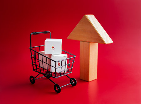 Inflation, online shopping sale profit, high cost economic, business marketing concepts. Price increase icon on parcel boxes in shopping cart trolley with big growth wood arrow on red background.の写真素材