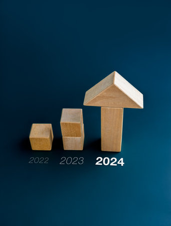 2022, 2023 and 2024 new year calendar number with wooden cube blocks bar graph chart steps with big arrowhead on blue background, vertical style. Investment, income, trends, business growth concepts.の写真素材