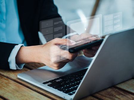 Online video tutorial learning concept. Play button icon on video tutorial screen channel display on mobile smartphone, horizontal style. Businessman watching education and inspiration on internet.の写真素材