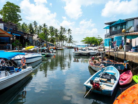 Ao Yai fisherman village scene with boats, sea and summer sky in Koh Kood island, a enduring holiday location for nature and outdoor travel in Thailand.のeditorial素材