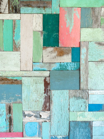 multicolor effective wood texture pattern background consists of several pieces of old wood of various sizes and colors, vertical style. Old wooden planks in multi-pastel colours vintage style.の写真素材