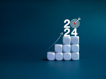2024 year number with target icon and rise up arrow on white blocks as a graph steps on blue background. New year trends, action plan, profit, business growth process, economic improvement concepts.の写真素材