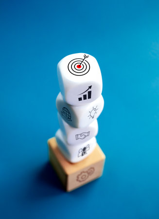 Business strategy with growth success process for for leadership and teamwork concept. The action plan, business target icon on white and wood cube blocks stack on blue background, vertical style.の写真素材