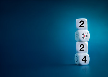 2024 Happy New year background banner. Numbers and target dart icon on white blocks stacked on dark blue background with copy space. Welcome, Merry Christmas, and Happy New Year in 2024.の写真素材