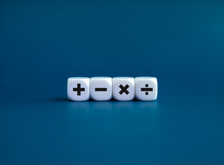 Plus, minus, multiplication and division signs on white dice cube blocks isolated on blue background, minimal style. Financial, mathematics and calculations concepts.の写真素材