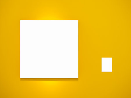 Mock up blank square canvas frame and white empty work caption for size, technique and artwork concept, hanging on yellow wall background. Template, empty space for artist paintings or photography.の写真素材