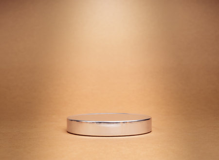 A round chrome as a podium with empty space for place products designs isolated on recycle paper background. Mockup display on brown kraft paper background, Technology and eco-Friendly concept.の写真素材