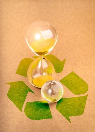Environmental sustainability, time and responsibility, conserve resources concept. Small glass world...