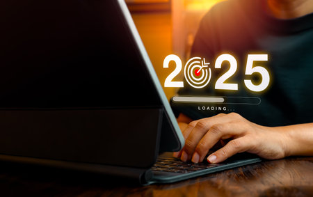 2025 year number with target goal icon and loading bar virtual on screen while businessman working...