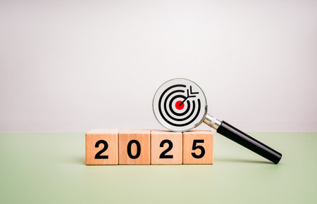 Happy new year 2025, business goal and trends concept. Target icon in magnifying glass lens on...