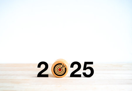 2025 Happy new year background. Target icon on round wooden block with 2025 calendar numbers,...