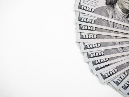 Top view of 100 us Dollars, money banknotes, arranged as a fan, money cash isolated on white...