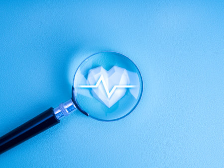 Heart rate icon, medical check up, healthcare concept. Pulse beat measure line on strong geometric white heart, focus in magnifying glass lens, isolated on light clean blue background, minimal style.の写真素材