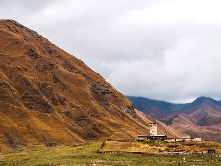 Scene of the Ushguli village, UNESCO heritage with many medieval towers and houses near the mountains and autumn landscape, tourist attraction in the Svaneti region, Georgia.の写真素材