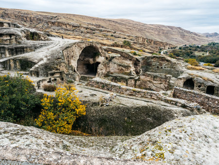 Uplistsikhe (the Lord's Fortress), the amazing UNESCO World Heritage site of cave city, ancient rock-hewn town with nature stone landscape on blue sky background, famous travel attraction at Georgia.の写真素材