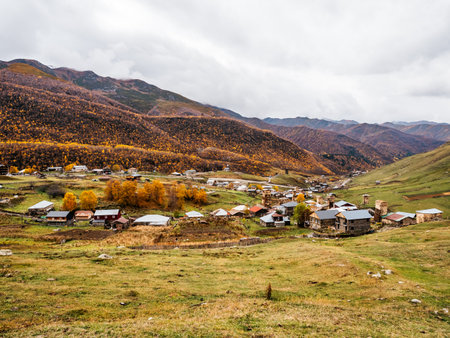 Scene of the Ushguli village, UNESCO heritage with many  houses near the mountains and autumn landscape, tourist attraction in the Svaneti region, Georgia.の写真素材