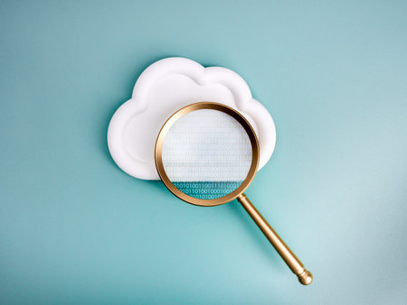 Cloud computing technology, security data system storage service, information searching concept. Binary code appear in magnifying glass lens, focus on white cloud shape, isolated on blue background.の写真素材