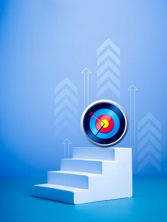 Market growth, investment goal, financial technology, business achievement concept. Modern 3d chrome target dart icon on top of white staircase steps with rising arrows on blue vertical background.の写真素材