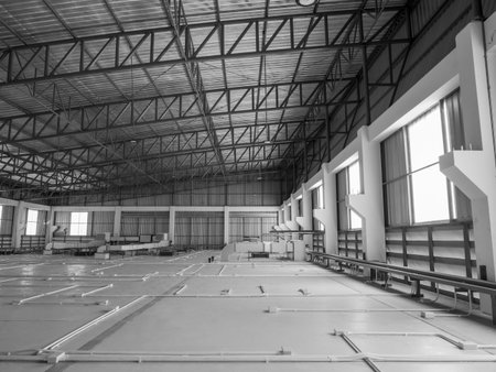Scene of interior buildings, steel and cement structure with air ventilation system on warehouse storage ceiling, under roof, with sunlight from windows. industrial factory construction concept.の写真素材