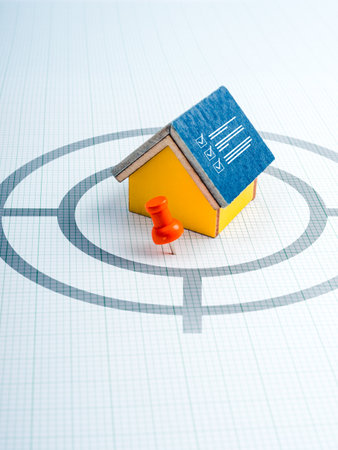 Home investment online, property value, house buying and selling, real estate concepts. Checklist icon on house model with location map pointer on target symbol on blue and graph paper background.の写真素材