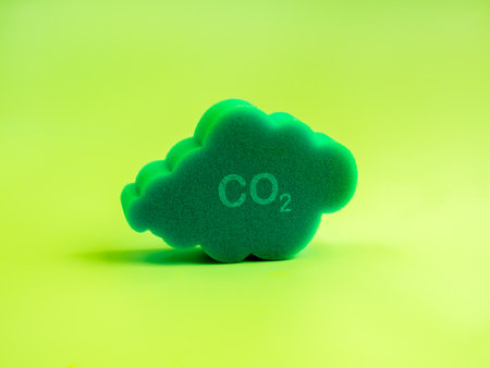 Environmental sustainability, Co2 emission reduction, net zero carbon dioxide reduction concept. Co2 icon on 3d sponge cloud shape, isolated on light green background, minimalist style.の写真素材