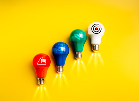 Cyber security, AI technology, environmental sustainability and business trends concept. Red, blue green and white colors of light bulbs rocket arranged as growth graph with icons, yellow background.の写真素材