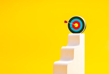 White staircase leading to modern 3D target icon with arrow hitting center on yellow background, concept of goal achievement, career growth, success strategy, business objective, and motivation.の写真素材