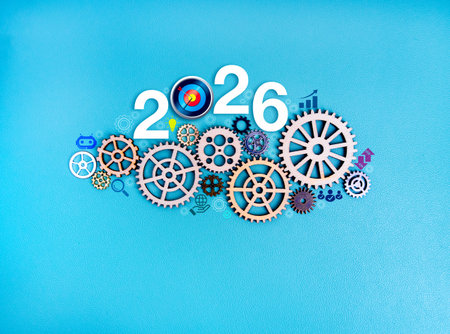 Number 2026 with wooden gears and business icons on blue background, symbolizing New Year growth planning, success strategy, teamwork, system development, and mechanism for future achievement.の写真素材
