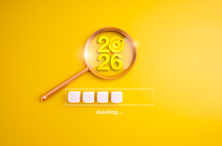 Magnifying glass focusing on 2026 numbers with loading bar on yellow background, symbolizing loading to new year 2026, business goals, future vision, strategy, planning, and goal-setting for success.の写真素材