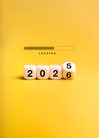 Loading bar with flipping white dices changing from 2025 to 2026 on yellow background, symbolizing new year countdown, upcoming design trends, fresh start, innovation, and future opportunities.の写真素材