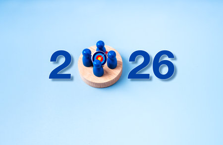 New year 2026 business concept with stakeholder figures around 3d target on wooden base between...