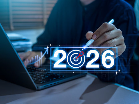 Businessman using AI technology to plan investment and career goals for 2026. Concept for new year success, income growth, digital strategy, future planning, and professional development.の写真素材
