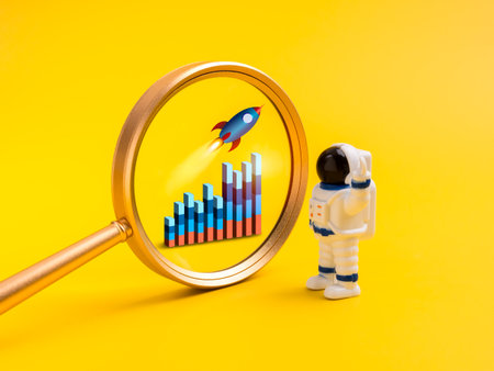 Creative concept of business startup growth with magnifying glass focusing on rocket and rising bar chart, astronaut figure looking at progress. Symbol of innovation, content strategy, creative idea.の写真素材