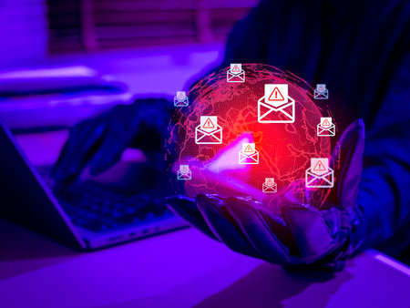 Hacker using email phishing scam to target victims worldwide. Cybersecurity threat increasing globally with digital fraud, identity theft, and data breach. Concept of online scam and cybercrime.の写真素材