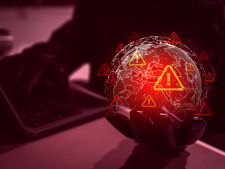 Cybercriminal with red alert icons and digital globe, symbolizing global rise of online scams, hackers, computer viruses, cyberattacks, data breaches, digital crime, and internet security threats.の写真素材