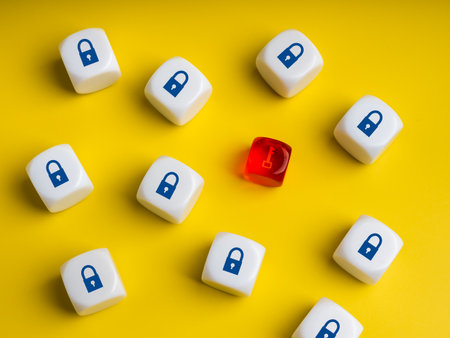 Minimal concept of cybersecurity with white dices showing padlock symbol and one red with key icon. Represents hacking, data breach, network vulnerability, and digital information protection.の写真素材