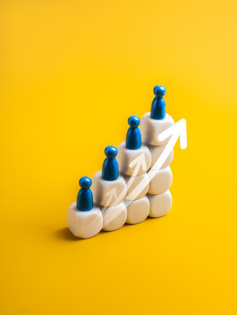 Minimal concept of population growth with blue figures on stacked white cubes and upward arrows. Symbolizes rising demographics, global development, human resources, and future planning trends.の写真素材
