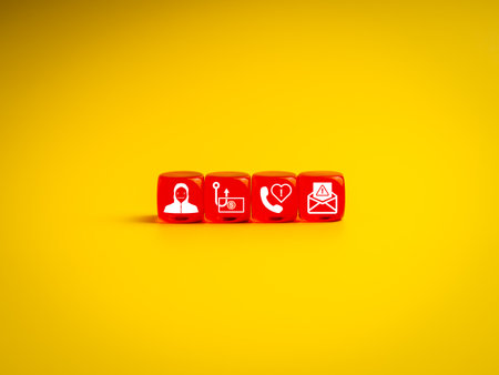 Red cubes with scam and fraud icons on yellow background represent various forms of online scams including phishing, romance fraud, fake calls, and hacker attacks. Ideal for cybersecurity themes.の写真素材