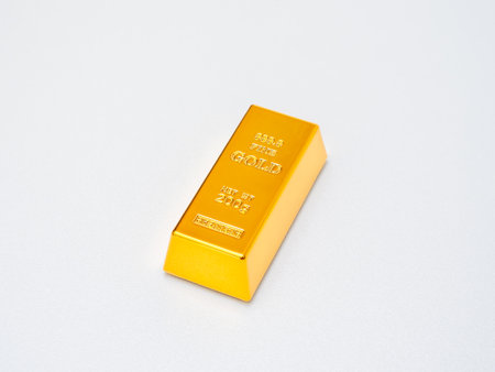Gold bar isolated on white background symbolizing wealth, investment, financial security, and safe...