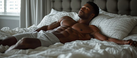 A body laying peacefully in bed, relaxed, beautiful showing six-pack absの素材