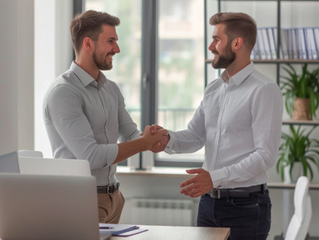 Professional Business Handshake in Modern Office Environmentの素材