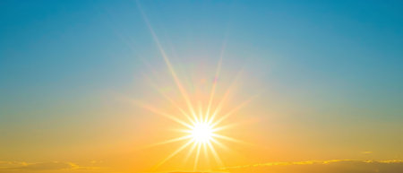 The sun shines brightly over the vast ocean, casting a radiant glow on the water. The sky is clear, with the suns rays reflecting off the waves.の素材