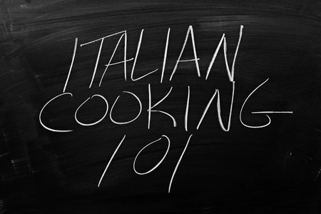 The words "Italian Cooking 101" on a blackboard in chalkの写真素材