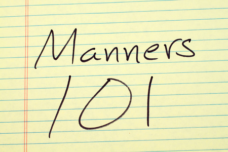 The words "Manners 101" on a yellow legal padの写真素材