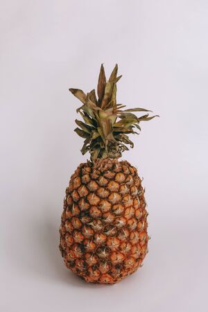 full Pineapple Sweet and leaves on a white background.