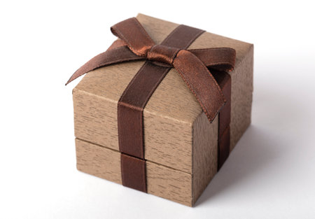 Brown box with a bow for jewelry on a white background.の写真素材