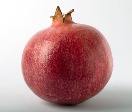Pomegranate on a white background close up, selective focus.の写真素材