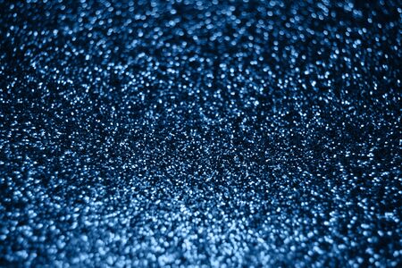 Festive blurry blue background of sequins with side effect. Color of the year 2020 concept.の写真素材