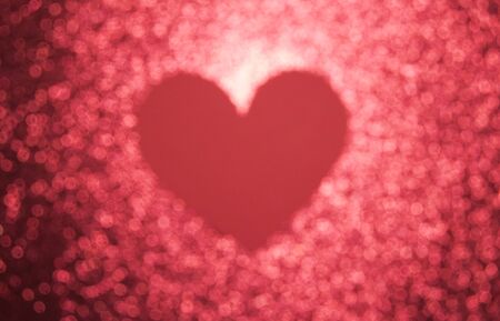Blurred background with sequins and a big heart for Valentine's Day, Valentine's Day. The concept of loveの写真素材